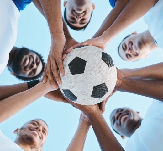 Soccer ball, support or team in a huddle for motivation, goals or group mission for a sports game o.